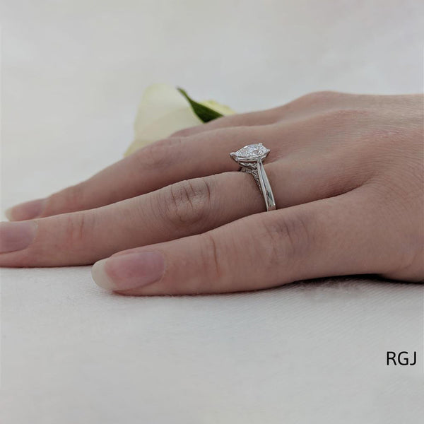The Oxford Platinum 0.70ct Pear Cut Diamond Solitaire Engagement Ring With 0.07ct Diamond Detailing