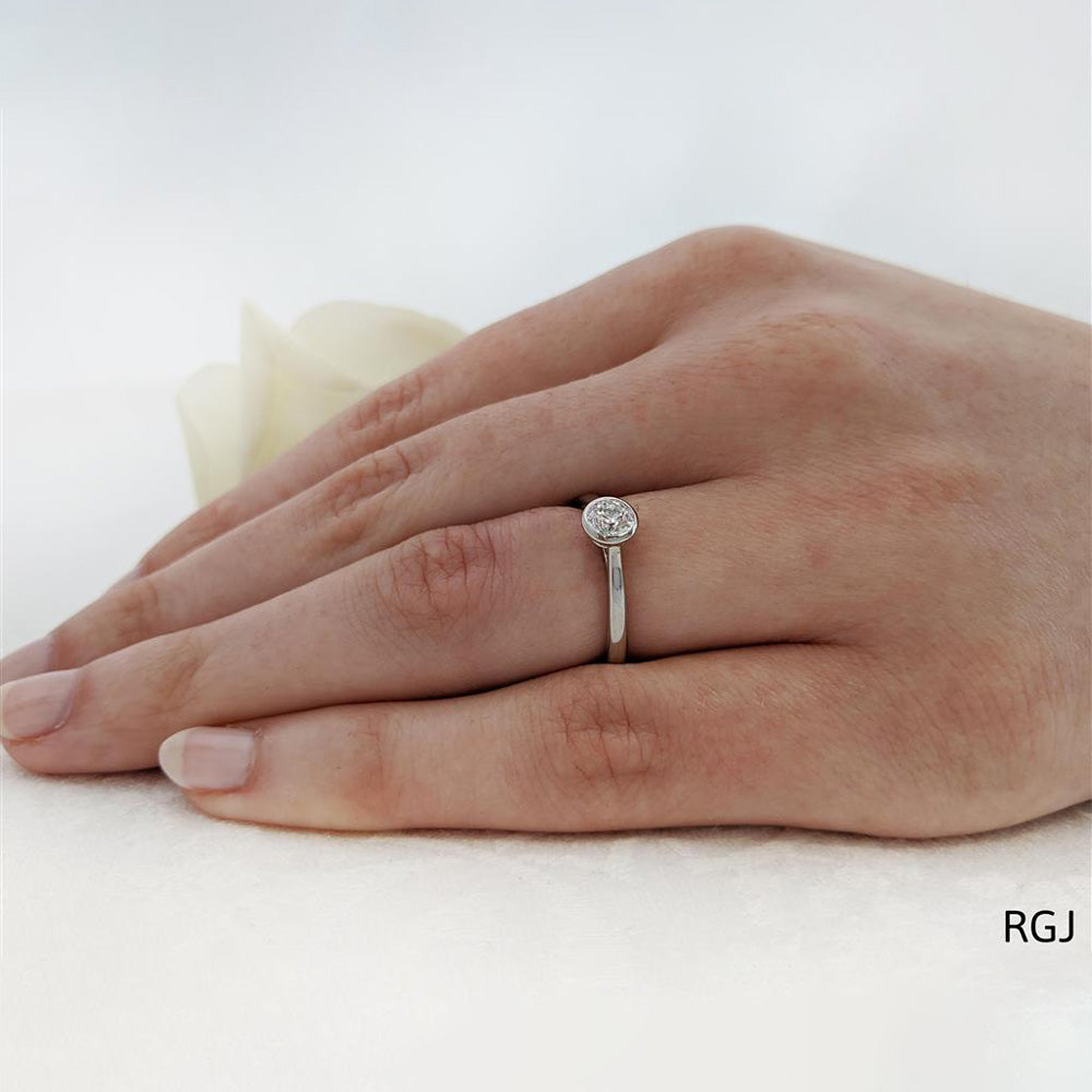 The Alena Platinum 0.50ct Round Brilliant Cut Diamond Solitaire Engagement Ring With 0.02ct Diamond Detailing