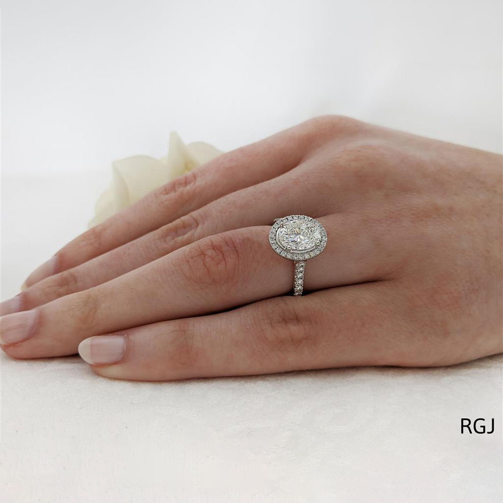 The Skye Platinum 2.01ct Oval Cut Diamond Engagement Ring With 0.44ct Diamond Halo And Diamond Set Shoulders