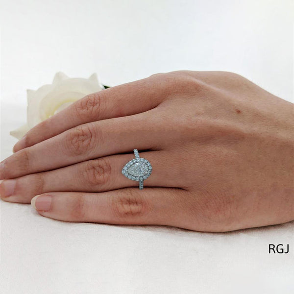The Evie Platinum 1.50ct Pear Cut Diamond Engagement Ring With 0.64ct Diamond Halo And Diamond Set SHoulders
