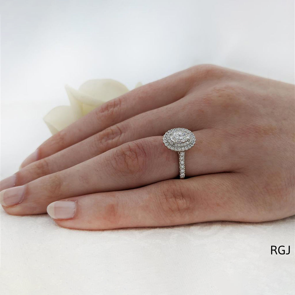 The Faroe Duo Platinum 0.63ct Oval Cut Diamond Engagement Ring With 0.41ct Scalloped Double Diamond Halo And Diamond Set Shoulders