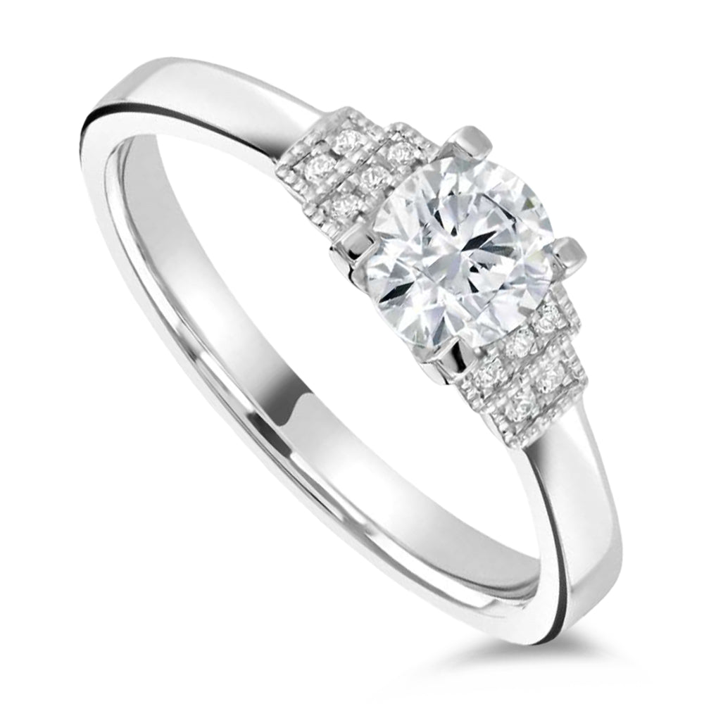 The Cornflower Platinum 0.38ct Round Brilliant Cut Diamond Solitaire Engagement Ring With 0.03ct Diamond Set Shoulders