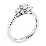 The Senna Platinum Round Brilliant Cut Diamond Three Stone Engagement Ring