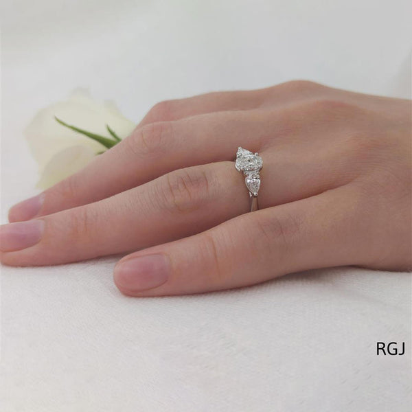 The Florentine Platinum 0.56ct Oval And 0.27ct Pear Cut Diamond Three Stone Engagement Ring