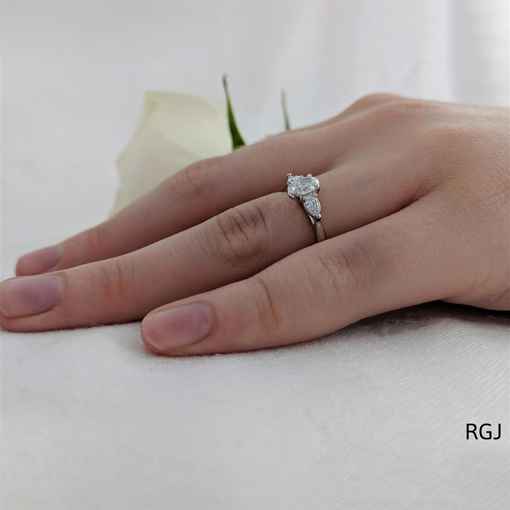 The Florentine Platinum 0.34ct Oval And 0.20ct Pear Cut Diamond Three Stone Engagement Ring