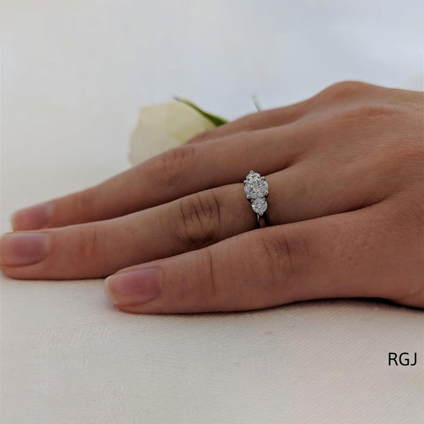 The Tulip Platinum 0.60ct Round Brilliant Cut Diamond Three Stone Engagement Ring