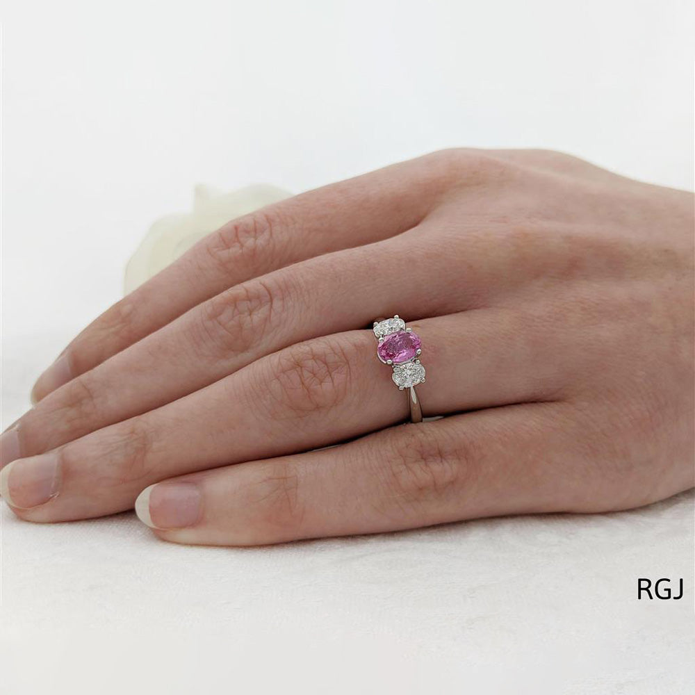 The Florentina Platinum 0.94ct Pink Sapphire And 0.60ct Diamond Oval Cut Three Stone Ring