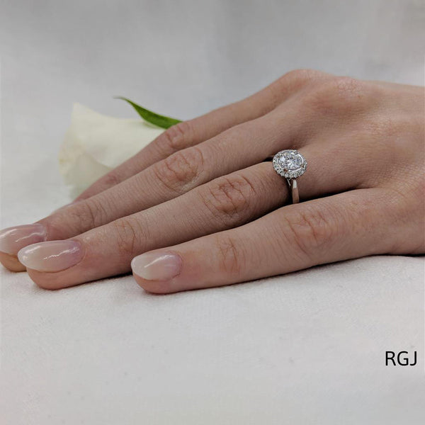 The Skye Pure Platinum 0.50ct Round Brilliant Cut Diamond Engagement Ring With 0.08ct Diamond Halo