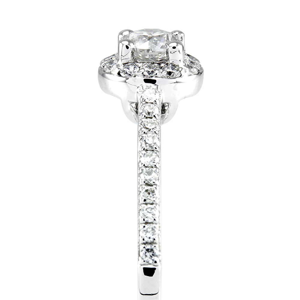 The Buttercup Platinum 0.10ct Round Brilliant Cut Diamond Halo Engagement Ring With 0.15ct Diamond Set Shoulders