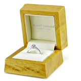 The Buttercup Platinum 0.10ct Round Brilliant Cut Diamond Halo Engagement Ring With 0.15ct Diamond Set Shoulders