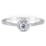 The Buttercup Platinum 0.10ct Round Brilliant Cut Diamond Halo Engagement Ring With 0.15ct Diamond Set Shoulders