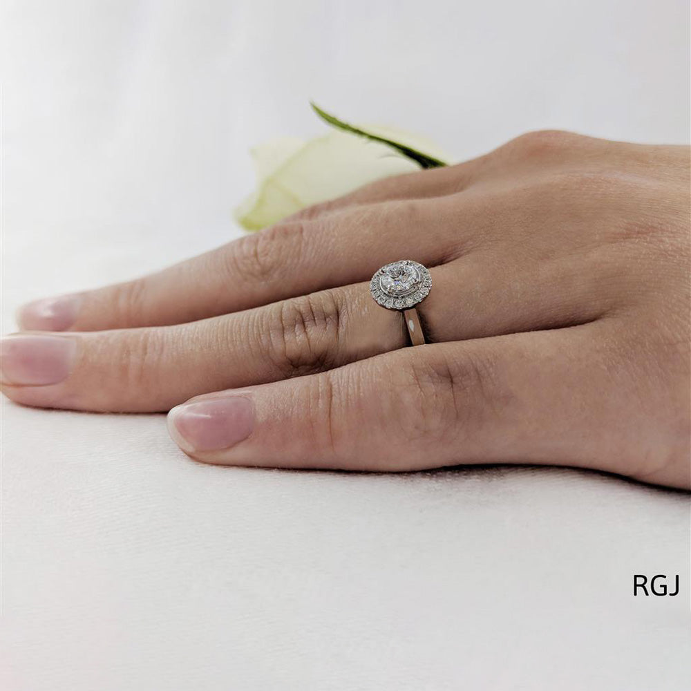 The Skye Pure Platinum 0.42ct Round Brilliant Cut Diamond Engagement Ring With 0.13ct Diamond Halo