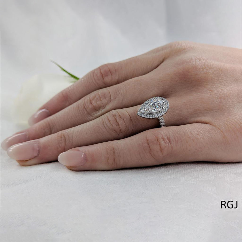 The Skye Platinum 1.53ct Pear Cut Diamond Engagement Ring With 0.42ct Diamond Halo And Diamond Set Shoulders