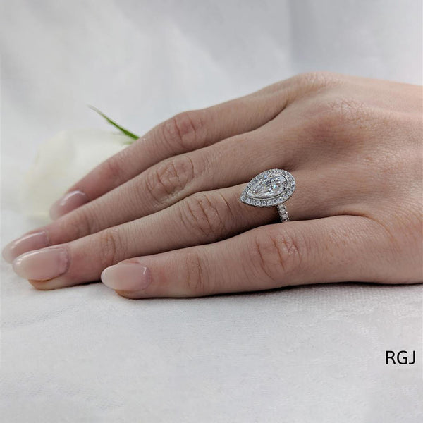 The Skye Platinum 1.53ct Pear Cut Diamond Engagement Ring With 0.42ct Diamond Halo And Diamond Set Shoulders