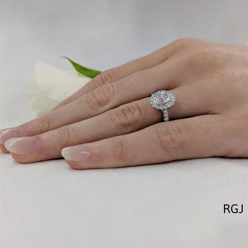 The Skye Platinum 0.50ct Oval Cut Diamond Engagement Ring with 0.33ct Diamond Halo And Diamond Set Shoulders
