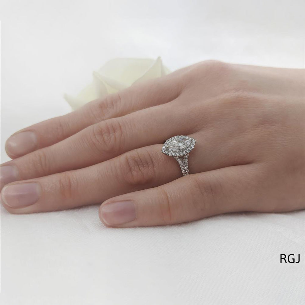 The Skye Saturn Platinum 0.45ct Marquise Cut Diamond Engagement Ring With 0.31ct Diamond Halo And Diamond Set Split Shoulders