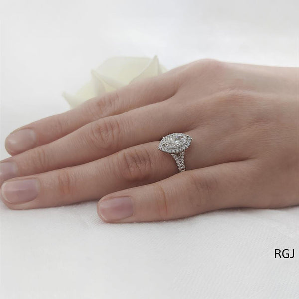 The Skye Saturn Platinum 0.45ct Marquise Cut Diamond Engagement Ring With 0.31ct Diamond Halo And Diamond Set Split Shoulders
