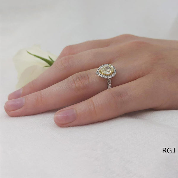 The Skye Platinum 0.57ct Pear Cut Yellow Diamond Engagement Ring With 0.33ct Diamond Halo And Diamond Set Shoulders