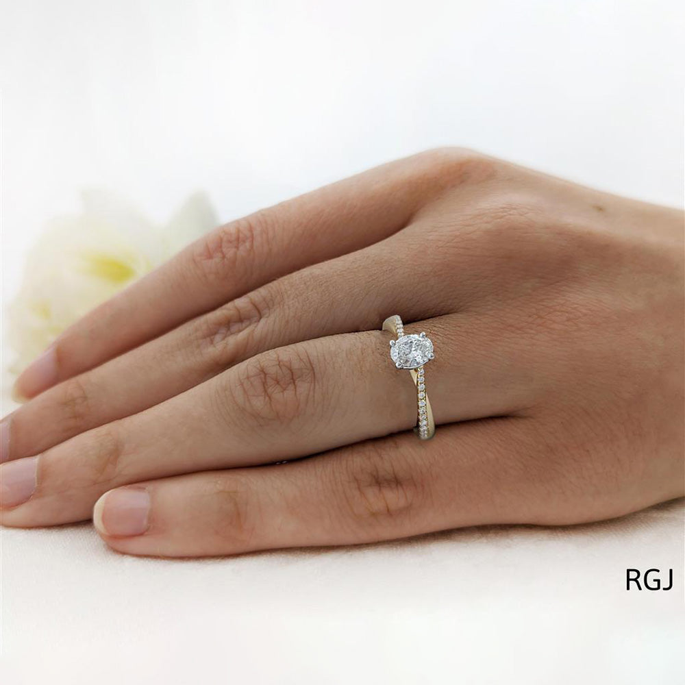 The Skye Twist 18ct Yellow Gold 0.60ct Oval Cut Diamond Engagement Ring With 0.14ct Diamond Twist Set Shoulders