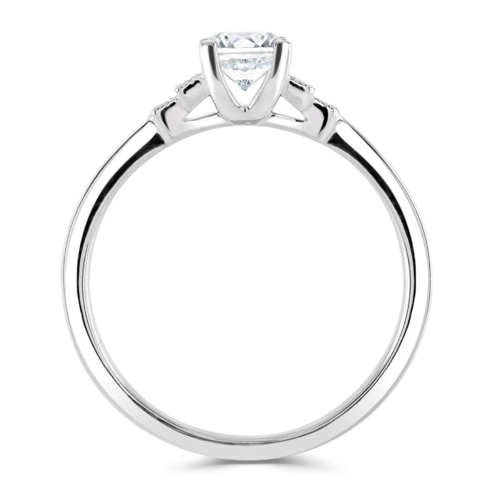 The Cornflower Platinum 0.38ct Round Brilliant Cut Diamond Solitaire Engagement Ring With 0.03ct Diamond Set Shoulders