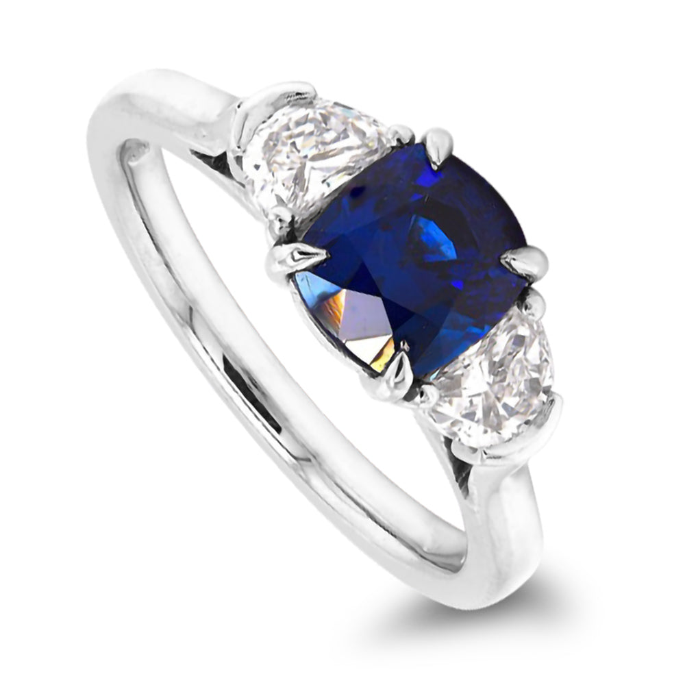 Platinum 2.87ct Oval Cut Blue Sapphire And 0.93ct Crescent Diamond Three Stone Ring