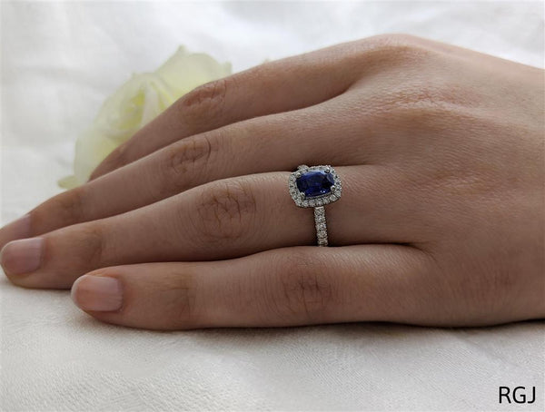 The Skye Platinum 1.46ct Cushion Cut Blue Sapphire Ring With 0.41ct Diamond Halo And Diamond Set Shoulders
