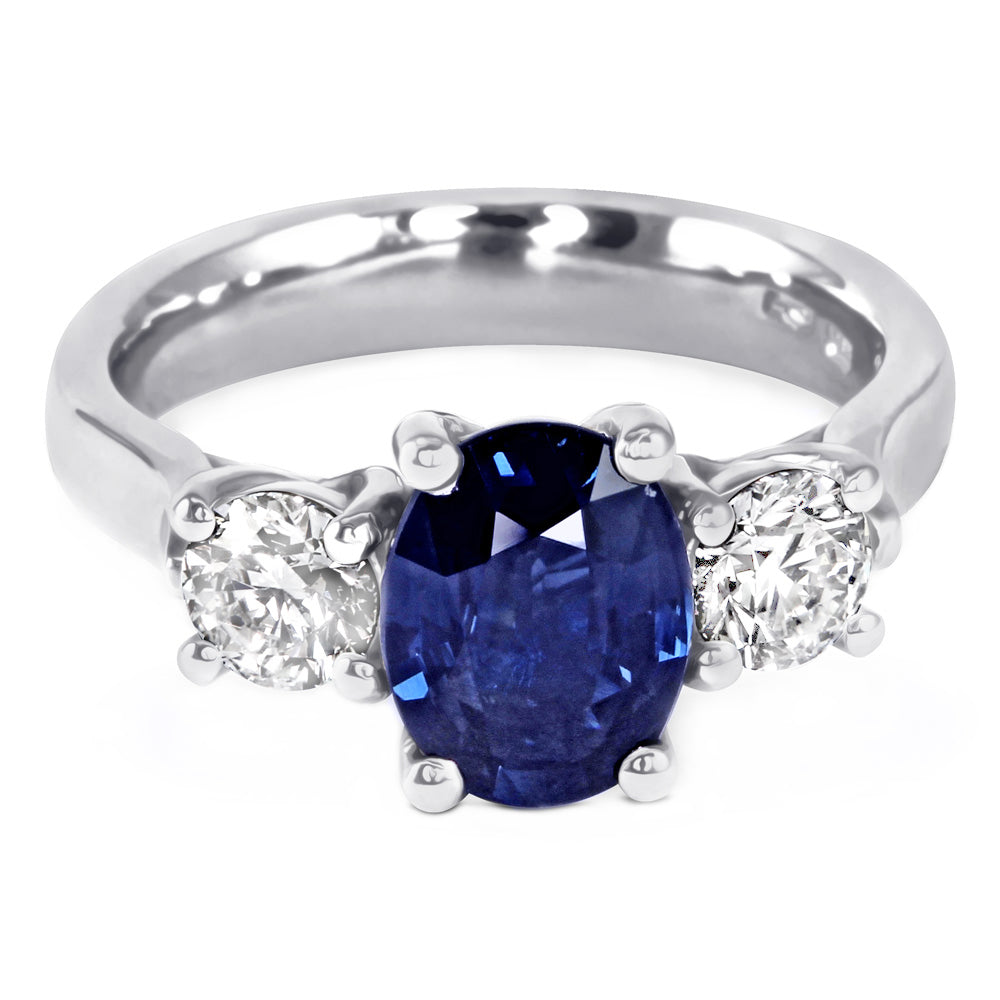 The Larkspur Platinum 2.14ct Oval Sapphire and 0.80ct Diamond Three Stone Engagement Ring