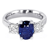 The Larkspur Platinum 2.14ct Oval Sapphire and 0.80ct Diamond Three Stone Engagement Ring