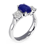 The Larkspur Platinum 2.14ct Oval Sapphire and 0.80ct Diamond Three Stone Engagement Ring