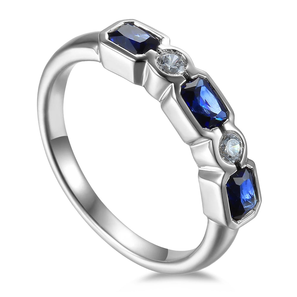18ct White Gold 0.89ct Octagon Cut Blue Sapphire And 0.11ct Round Brilliant Cut Diamond Five Stone Ring