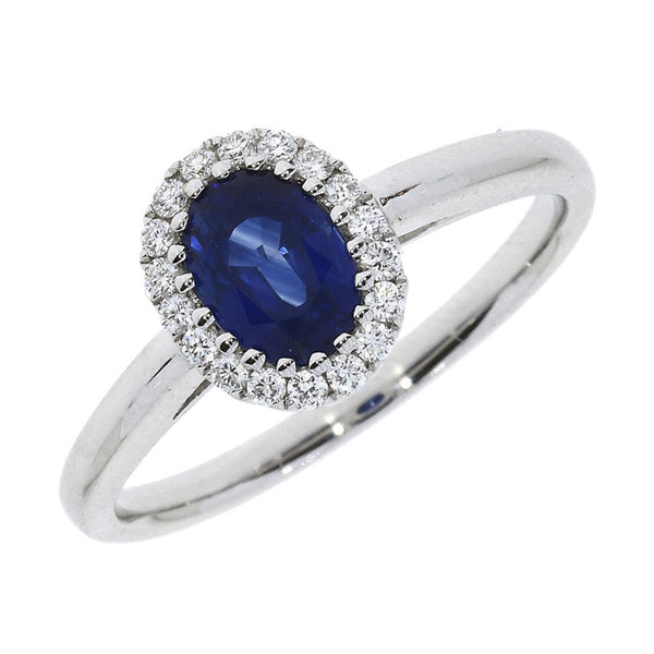 18ct White Gold 1.28ct Oval Cut Blue Sapphire And 0.17ct Round Brilliant Cut Diamond Cluster Ring