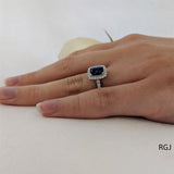 The Skye Platinum 1.81ct Cushion Cut Blue Sapphire Ring With 0.43ct Diamond Halo And Diamond Set Shoulders