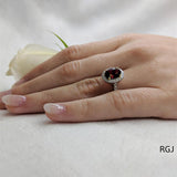 The Skye Platinum 2.13ct Oval Cut Ruby Ring With 0.42ct Diamond Halo And Diamond Set Shoulders