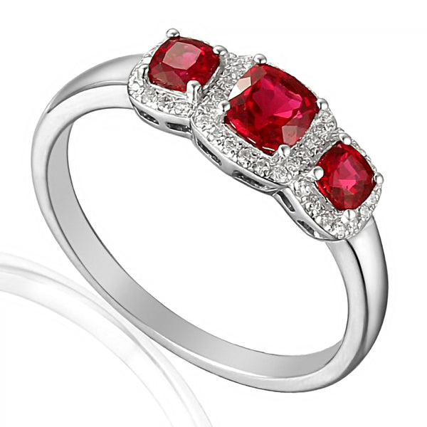 18ct White Gold 0.65ct Cushion Cut Ruby Three Stone Ring With 0.11ct Diamond Halo