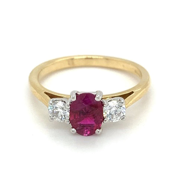 18ct Yellow And White Gold 0.88ct Oval Cut Ruby And 0.37ct Round Brilliant Cut Diamond Three Stone Ring