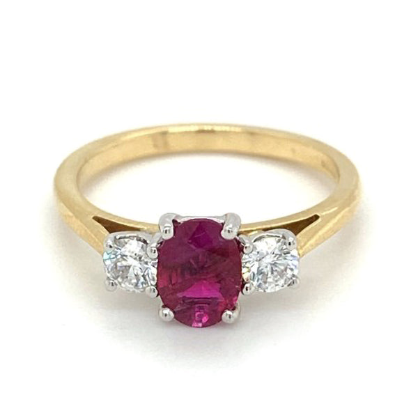 18ct yellow and white gold 0.76ct oval cut ruby and 0.36ct round brilliant cut diamond three stone ring
