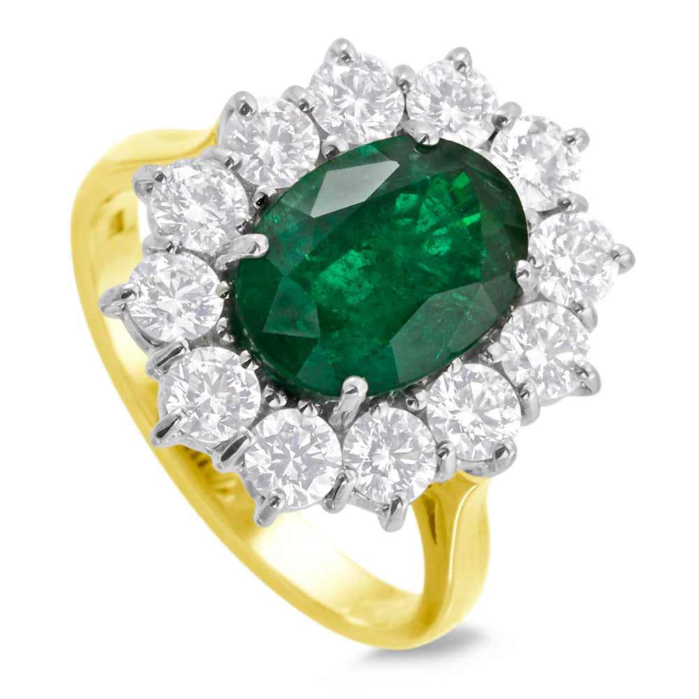 18ct Yellow And White Gold 3.33ct Oval Cut Emerald And 1.74ct Round Brilliant Cut Diamond Cluster Ring