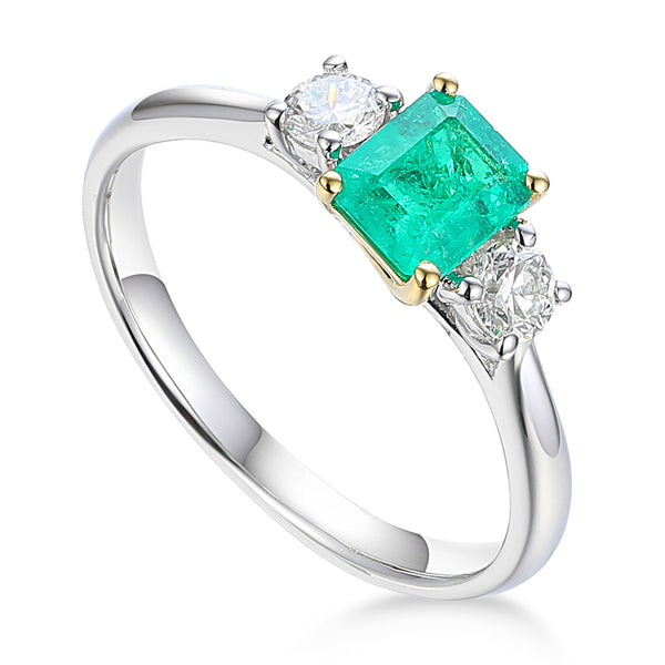 Platinum 0.51ct Octagon Cut Emerald And 0.27ct Round Brilliant Cut Diamond Three Stone Ring