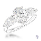 Platinum 1.04ct Oval And 0.62ct Pear Cut Laboratory Grown Diamond Three Stone Engagement Ring