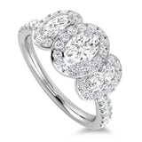 Platinum 1.30ct Oval Cut Diamond Three Stone Ring With Diamond Halo And Diamond Set Shoulders