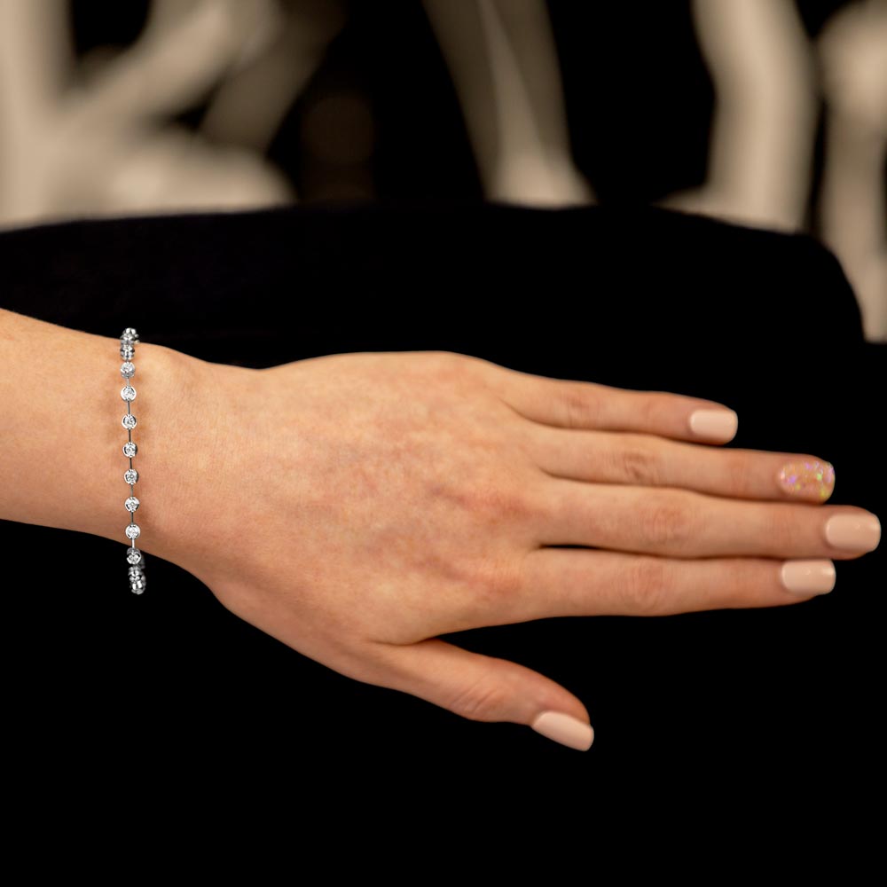18ct white gold round brilliant cut diamond bar set bracelet model shot extended wrist