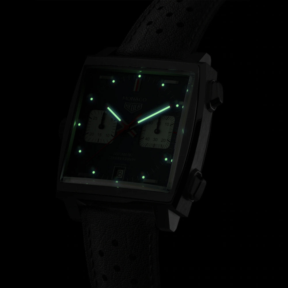 tag heuer monaco 36mm blue dial automatic chronograph watch front side facing in the dark image
