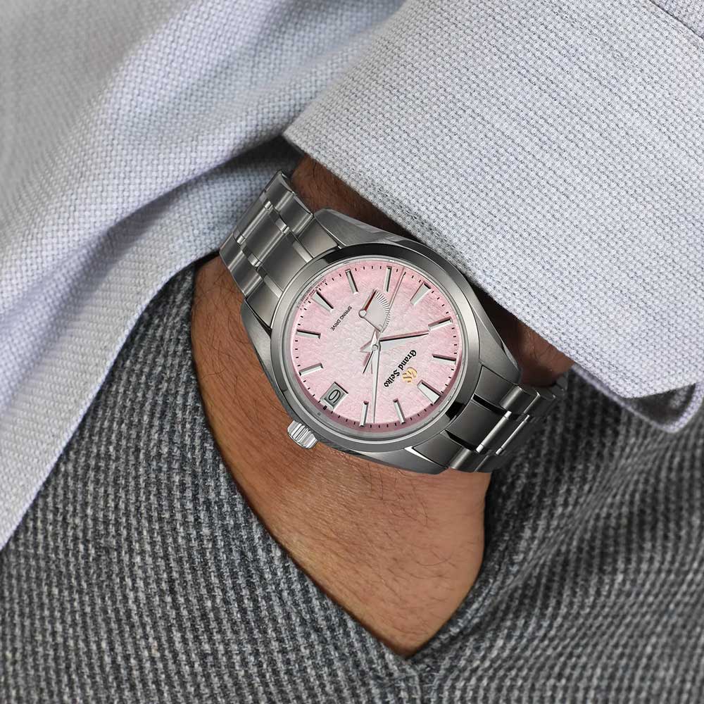 grand seiko pink snowflake spring drive 20th anniversary limited edition 41mm pink dial steel on steel bracelet automatic watch lifestyle image