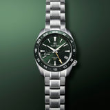 grand seiko sports collection spring drive gmt 44.5mm green dial stainless steel gents watch front facing upright image