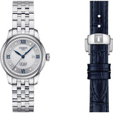tissot le locle automatic lady 20th anniversary 29mm silver diamond dot dial stainless steel watch on metal bracelet showings its complementary blue leather strap