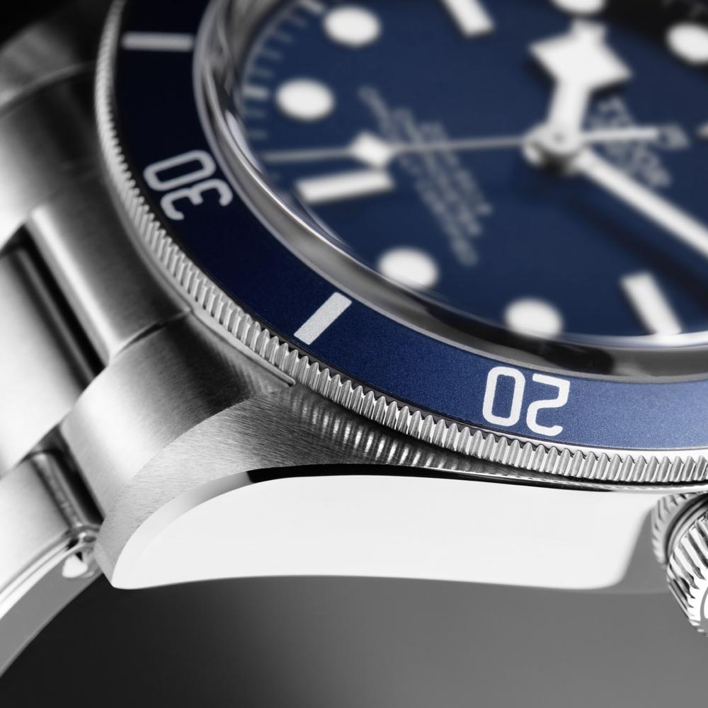 tudor black bay 58 39mm blue dial steel on steel bracelet automatic watch bezel closeup