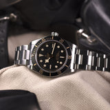 tudor black bay 58 39mm black dial steel on steel bracelet automatic watch lifestyle image