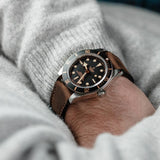tudor black bay 58 39mm black dial steel on leather strap automatic watch lifestyle image