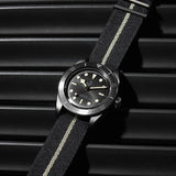 tudor black bay ceramic 41mm black dial ceramic on black fabric strap automatic watch lifestyle image