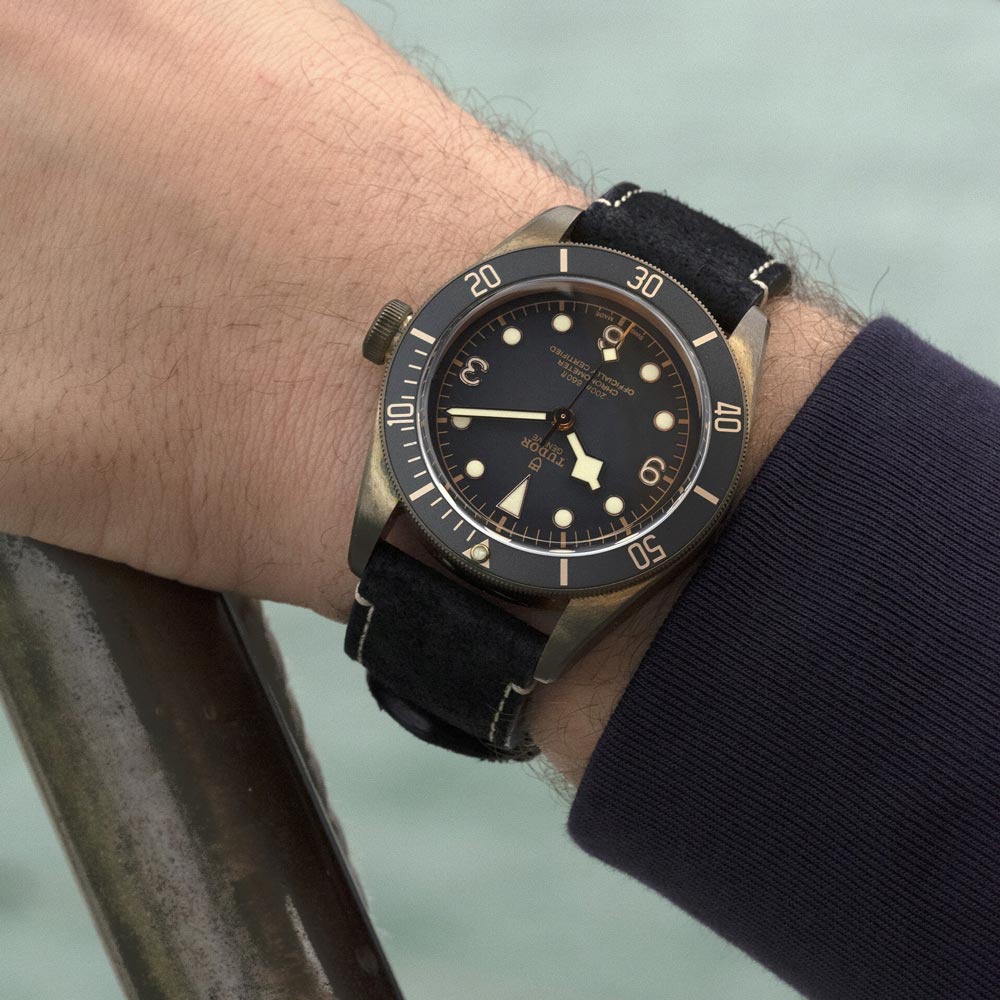 tudor black bay bronze 43mm slate grey dial bronze on leather strap automatic watch lifestyle image